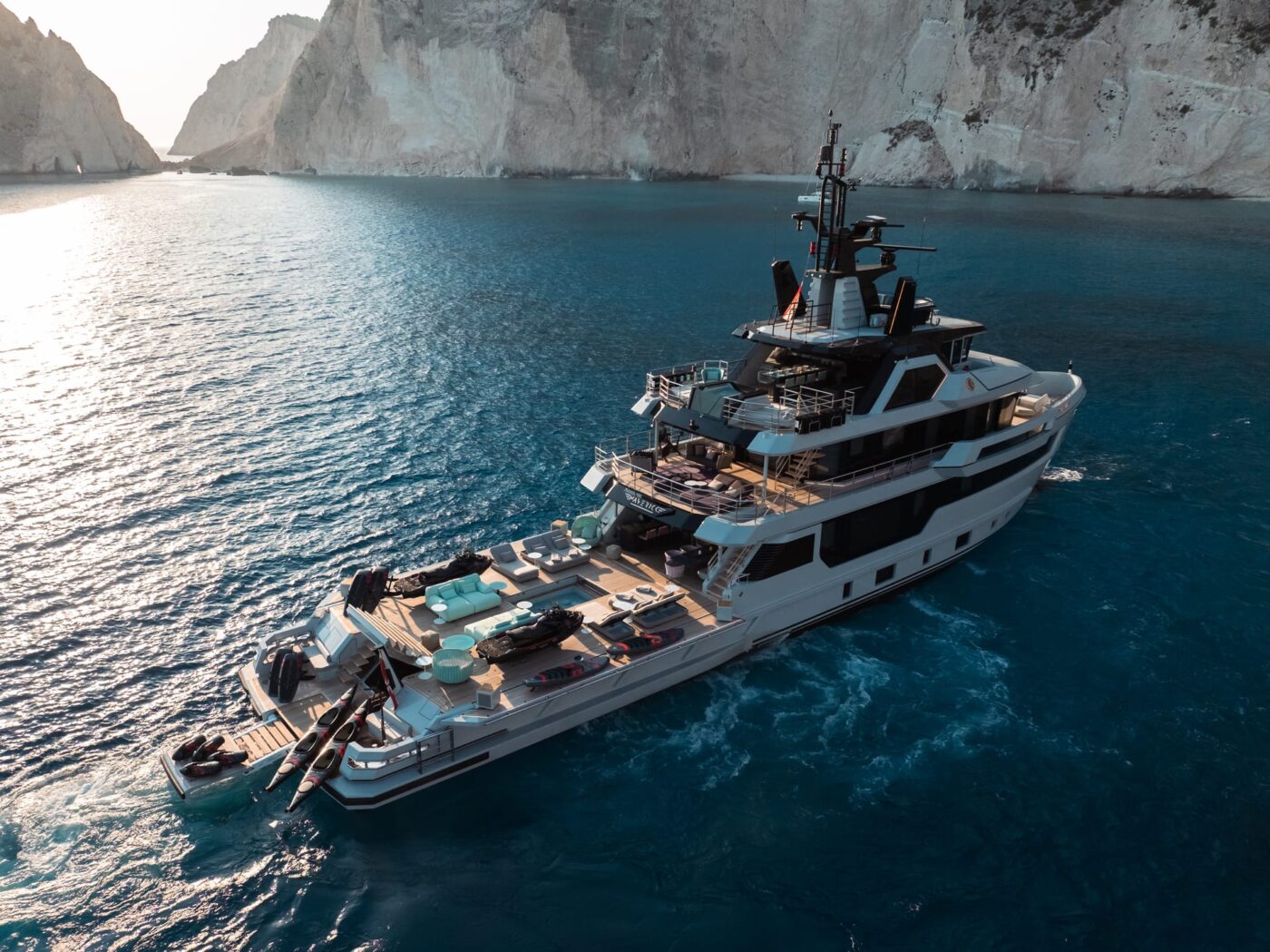 On main deck aft, both side bulwarks can be folded down, thus enlarging the deck space and
                                    offering a perfect diving platform. 6 mt in length and covered with teak, when opened the bulwarks
                                    sit perfectly flush with the main deck surface.