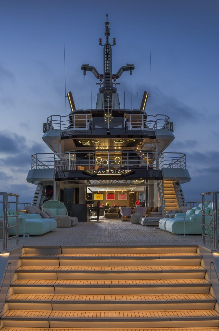 As her name suggests, the Flexplorer’s defining trait is flexibility. Her expansive aft main deck can serve multiple purposes: as a carrier for toys, she can easily accommodate a tender of up to 30 feet, a sailboat, and jet skis or even a submarine, handled by an ingenuous A-frame crane. Once the toys are launched, the vast deck transforms into a generous beach area, with seating and sunbeds arranged around a swimming pool, fold-down bulwarks, and stern steps leading directly to the sea. As evening falls, tables can be set with candles, soft lighting, delicate fragrances, and gentle music to create the perfect atmosphere. And when the night draws to a close, the deck becomes a sanctuary under the stars — a place where the sea itself provides the final embrace of the day.